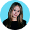 Smiling woman with long hair wearing a black top against a blue circular background.